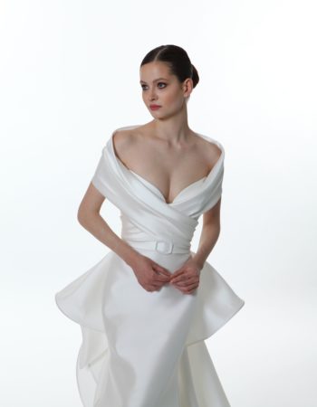 Closeup of a new valentini spose spring 2022 mikado off the shoulder wedding dreess with a fitted silhouette