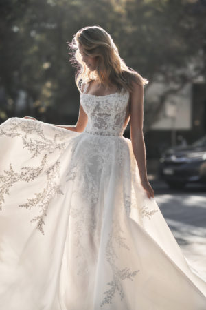Front view of Leah Da Gloria's Mabel an embroidered tulle sheath wedding dress with the removable A line overskirt