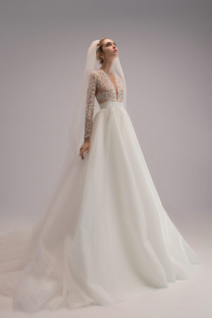 Ersa Atelier Eris long sleeve lace wedding dress with an organza a line skirt and long sleeves at dimitra's bridal in chicago.
