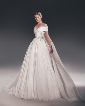 Zuhair Murad fall 2022 kim wedding dress at dimitras bridal chicago featuring an off the shoulder ruched chiffon ballgown wedding dress with beaded appliques and removable cape